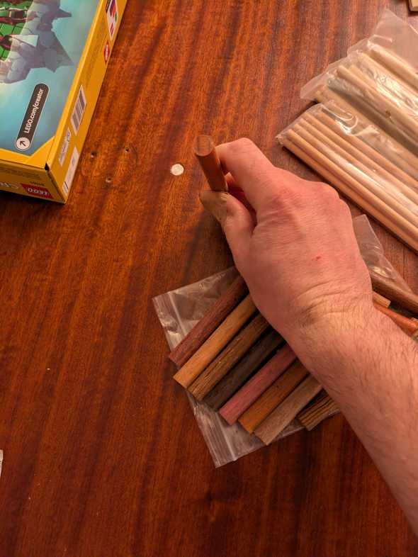 dowel held next to a hole it will eventually be jammed into