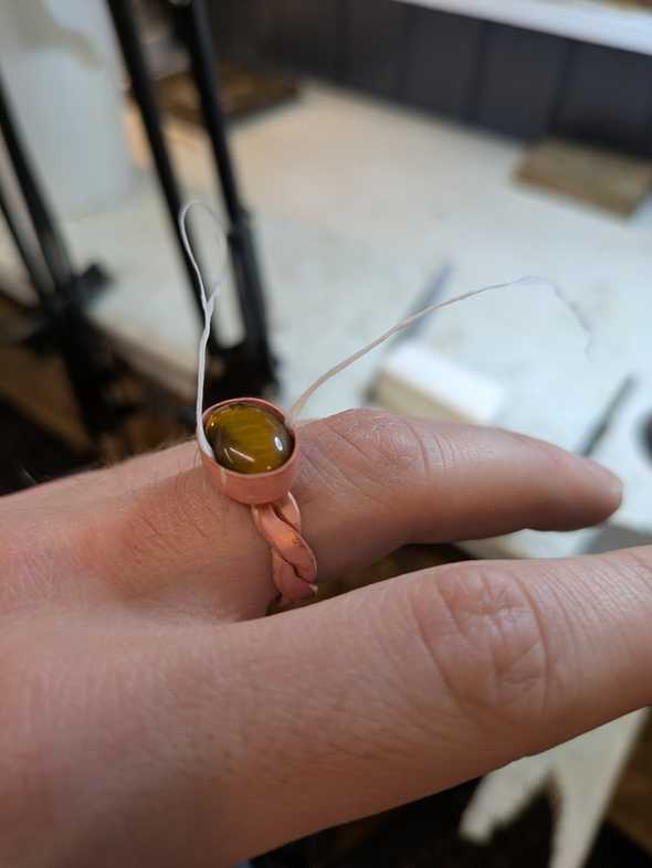 a brass ring with a bezel set on top