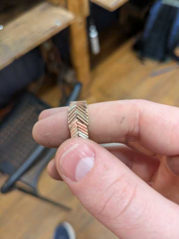 herringbone brass wire pattern soldered into a loop